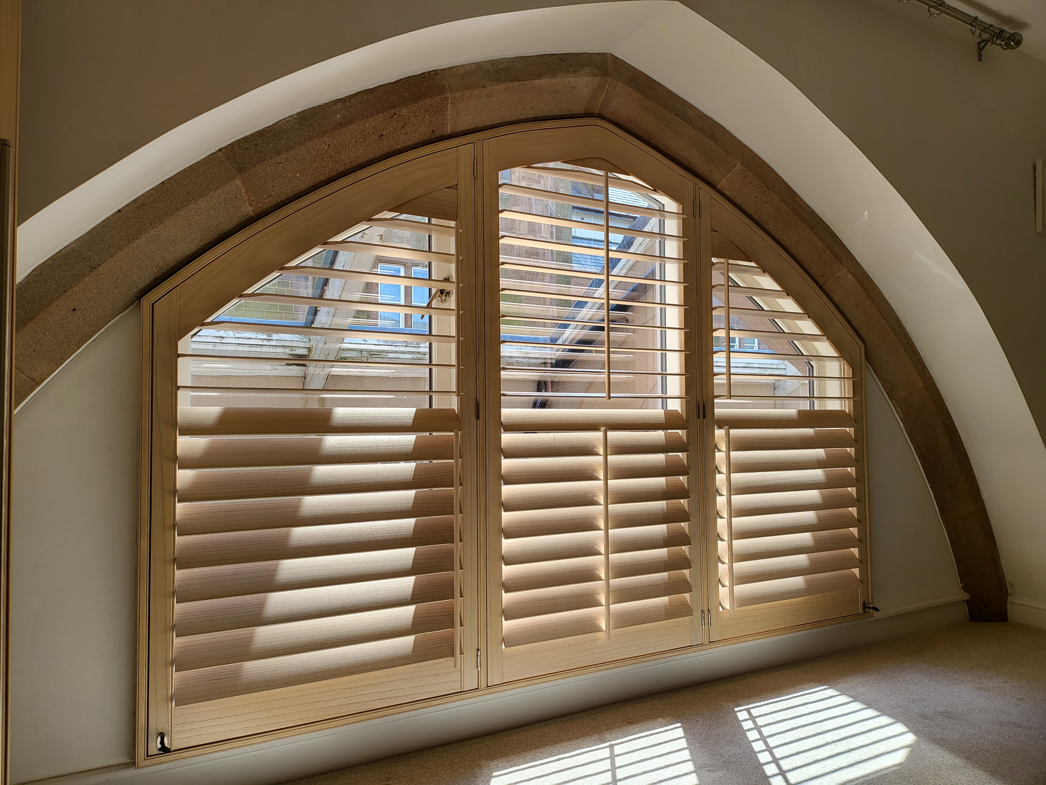 arched wooden shutters